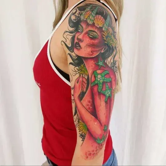 female classy half sleeve tattoo