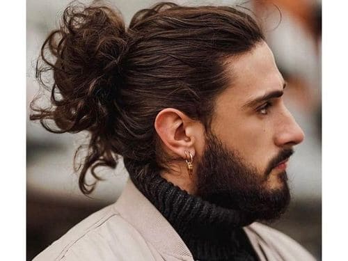Long Curly Haircut With A Bun