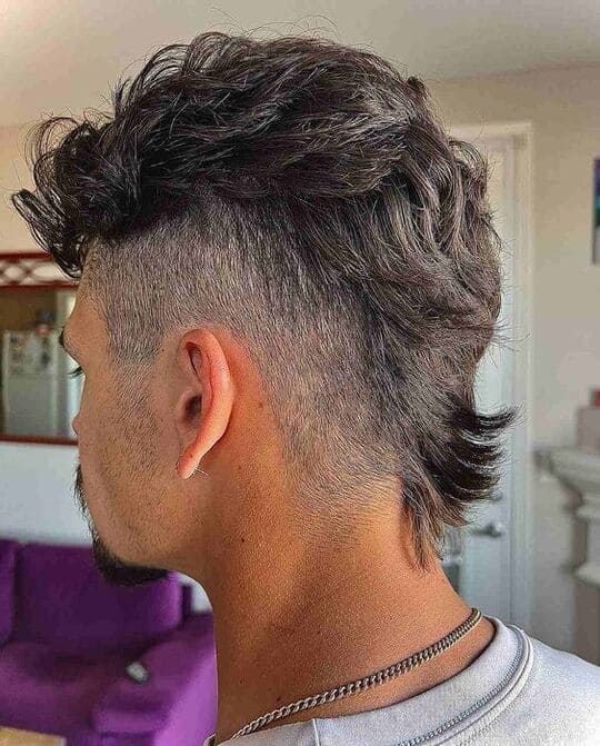messy mohawk style burst fade haircut